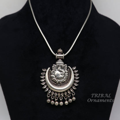 Sterling silver Lord Ganesha pendant with hanging bells from Tribal Ornaments, tribal jewelry necklace, detailed and decorative design.