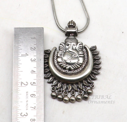 Sterling silver Lord Ganesha pendant with hanging bells, tribal jewelry necklace featuring intricate tribal ornament design.