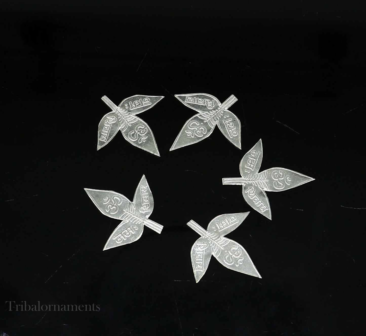 Set of 5 handmade solid silver Belva leaves for Shiva puja, featuring Shiva mantras, crafted by Tribal Ornaments.