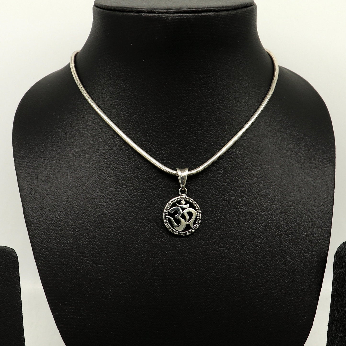 Sterling silver OM AUM pendant by TRIBAL ORNAMENTS, stylish handmade unisex jewelry featuring a personalized design.