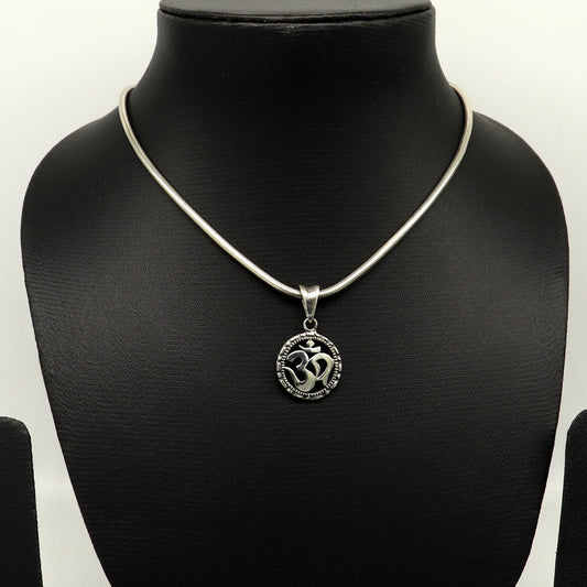 Sterling silver OM AUM pendant by TRIBAL ORNAMENTS, stylish handmade unisex jewelry featuring a personalized design.