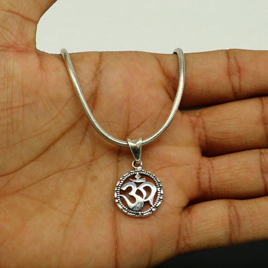Sterling silver OM AUM pendant by TRIBAL ORNAMENTS, handmade unisex jewelry with intricate design, personalized and stylish.
