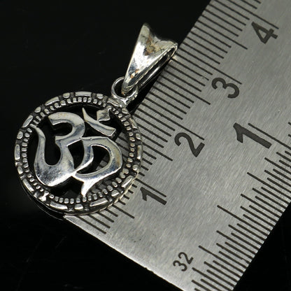 Sterling silver OM 'AUM' pendant from TRIBAL ORNAMENTS, stylish handmade unisex jewelry with personalized design.