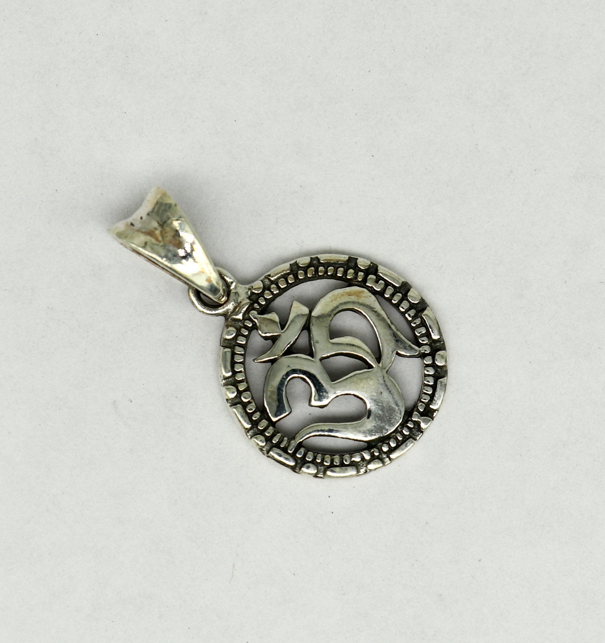 Sterling silver OM AUM pendant by Tribal Ornaments, handmade unisex jewelry with intricate design, stylish personalized silver necklace