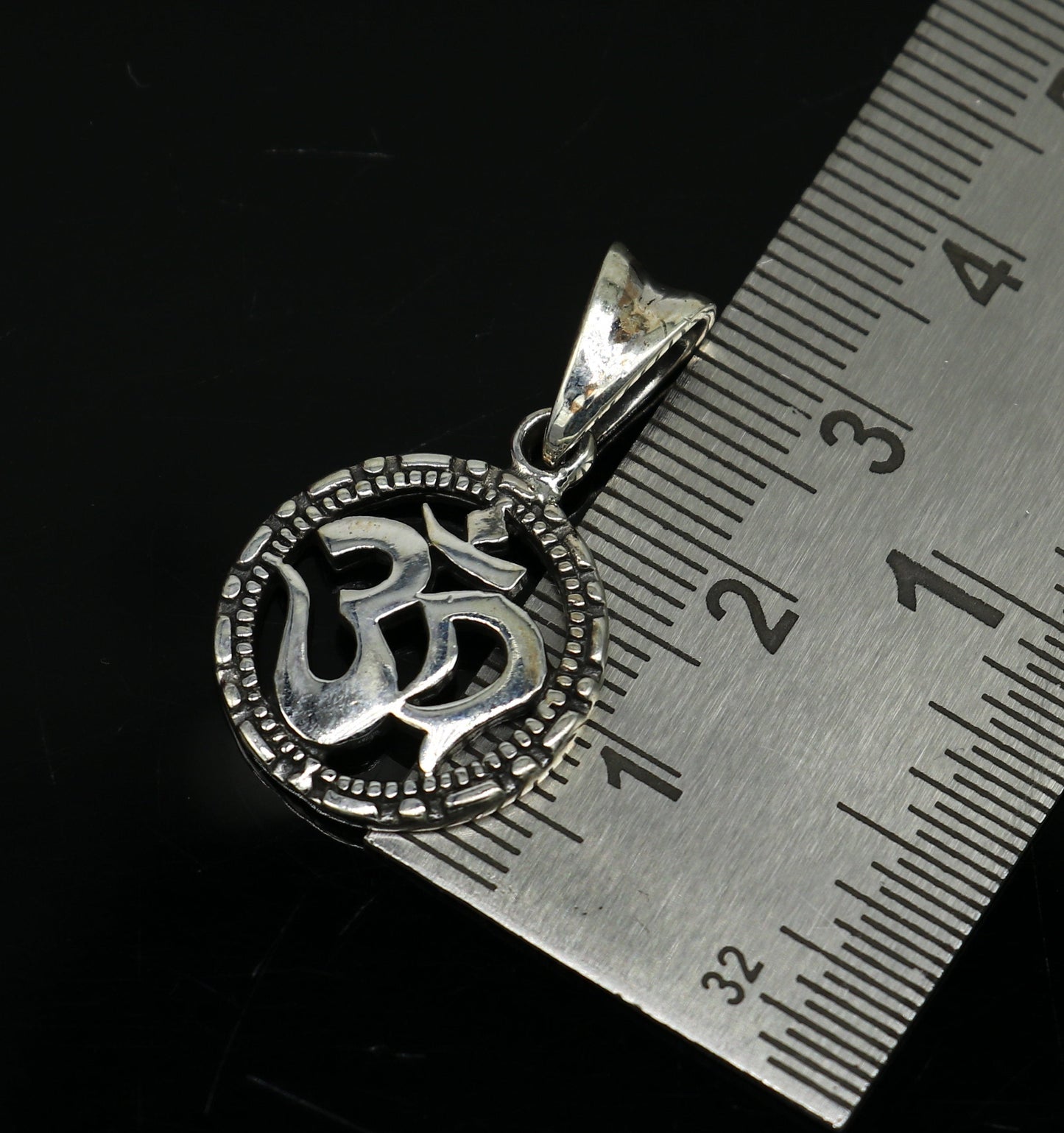 925 sterling silver OM AUM pendant by TRIBAL ORNAMENTS, stylish handmade unisex jewelry with personalized design and intricate detailing.