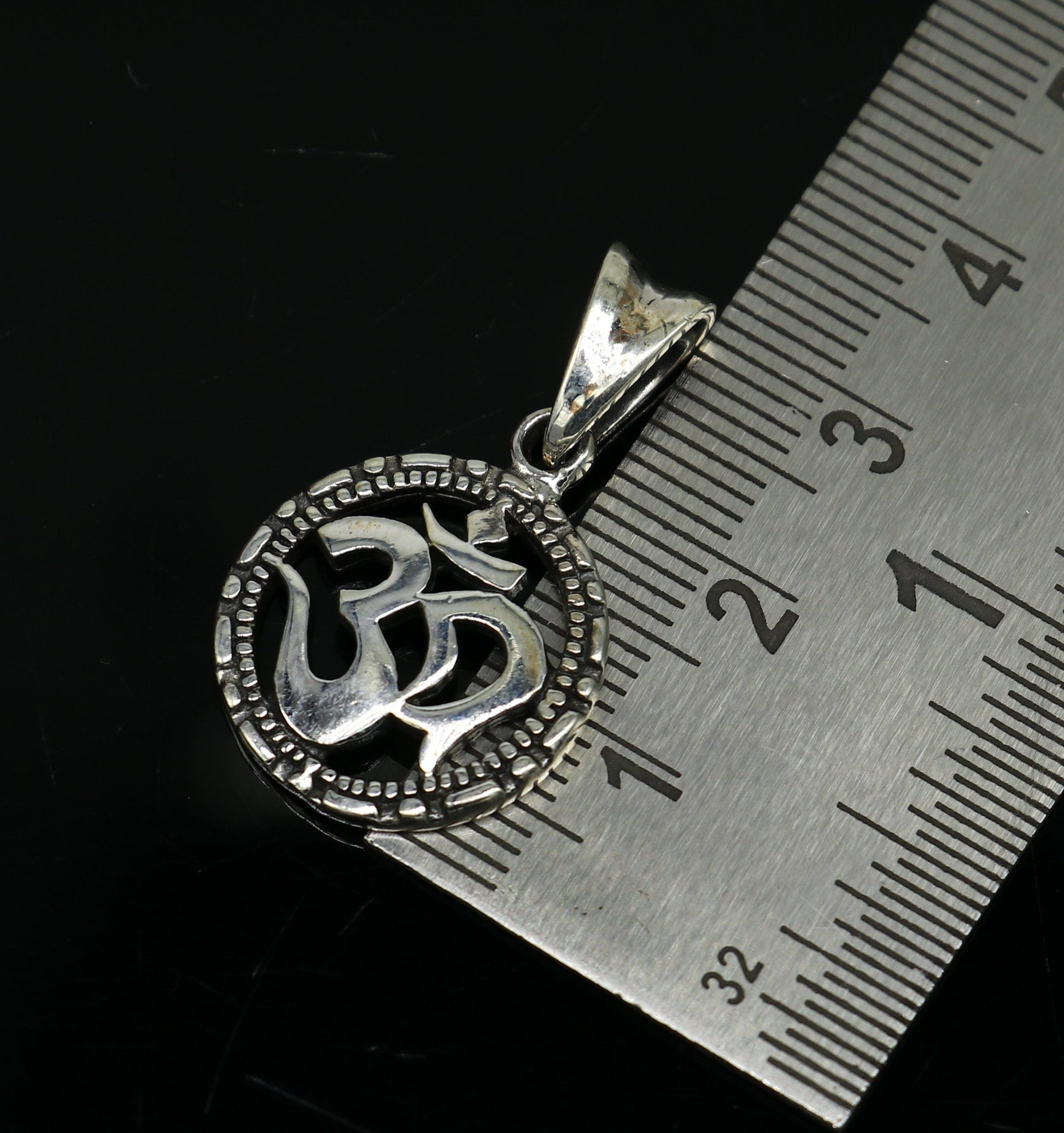 925 sterling silver OM AUM pendant by TRIBAL ORNAMENTS, stylish handmade unisex jewelry with personalized design and intricate detailing.