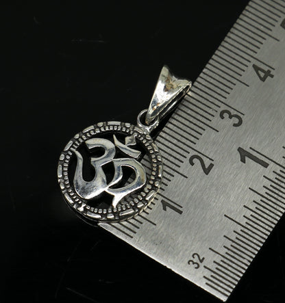 925 sterling silver OM AUM pendant by TRIBAL ORNAMENTS, stylish handmade unisex jewelry with personalized design and intricate detailing.