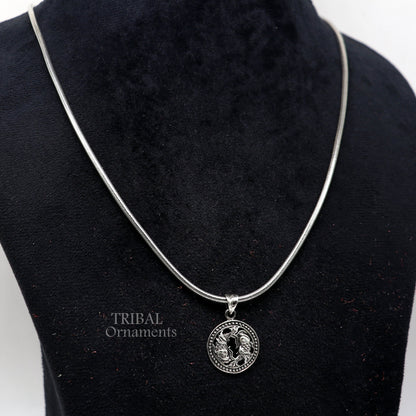 Sterling silver Pisces zodiac sign pendant featuring the Meen Rashi symbol, tribal-inspired horoscope jewelry.