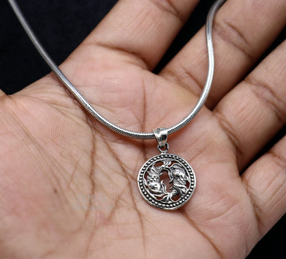 Sterling silver Pisces zodiac sign pendant featuring the Meen Rashi symbol, intricate tribal-inspired design and horoscope jewelry.