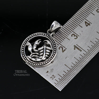 Sterling silver Scorpio zodiac sign pendant featuring the "Vrischik Rashi" symbol, tribal-inspired jewelry design.