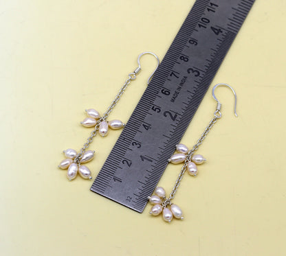 Natural oval-shaped pearl hangings and customized 925 sterling silver hoops earrings by Tribal Ornaments for brides and fashion jewelry.