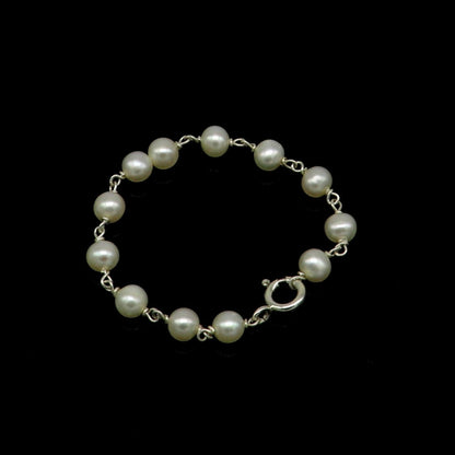 Natural pearl beaded baby bracelet made of 925 sterling silver by Tribal Ornaments, suitable for newborns and handmade customization.