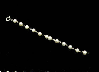 Natural pearl beaded baby bracelet with 925 sterling silver, handmade and customized, designed for newborns by Tribal Ornaments.