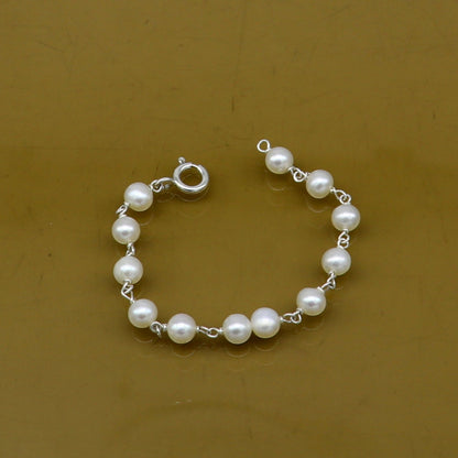 Natural pearl beaded baby bracelet made of 925 sterling silver, handmade and customized by TRIBAL ORNAMENTS for newborns.