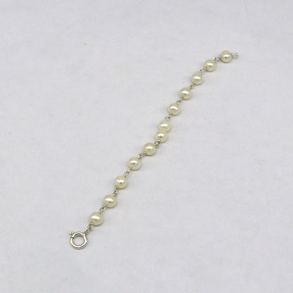 Handmade baby bracelet with natural 5mm pearl beads and 925 sterling silver, customized baby jewelry by TRIBAL ORNAMENTS.