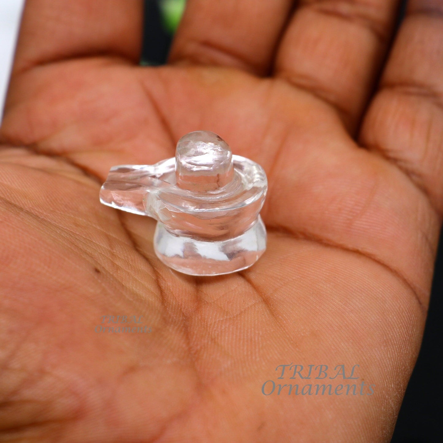 Natural sphatik crystal Shiva Lingam statue by TRIBAL ORNAMENTS, ideal for puja, wealth, and prosperity rituals.