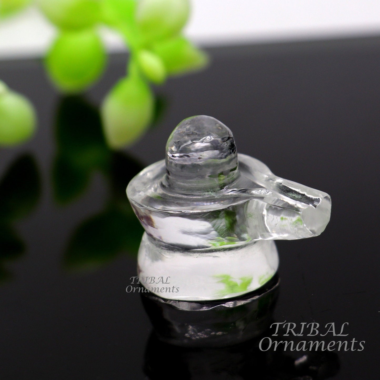 Natural Sphatik crystal Shiva Lingam statue by Tribal Ornaments, ideal for wealth and prosperity puja rituals.