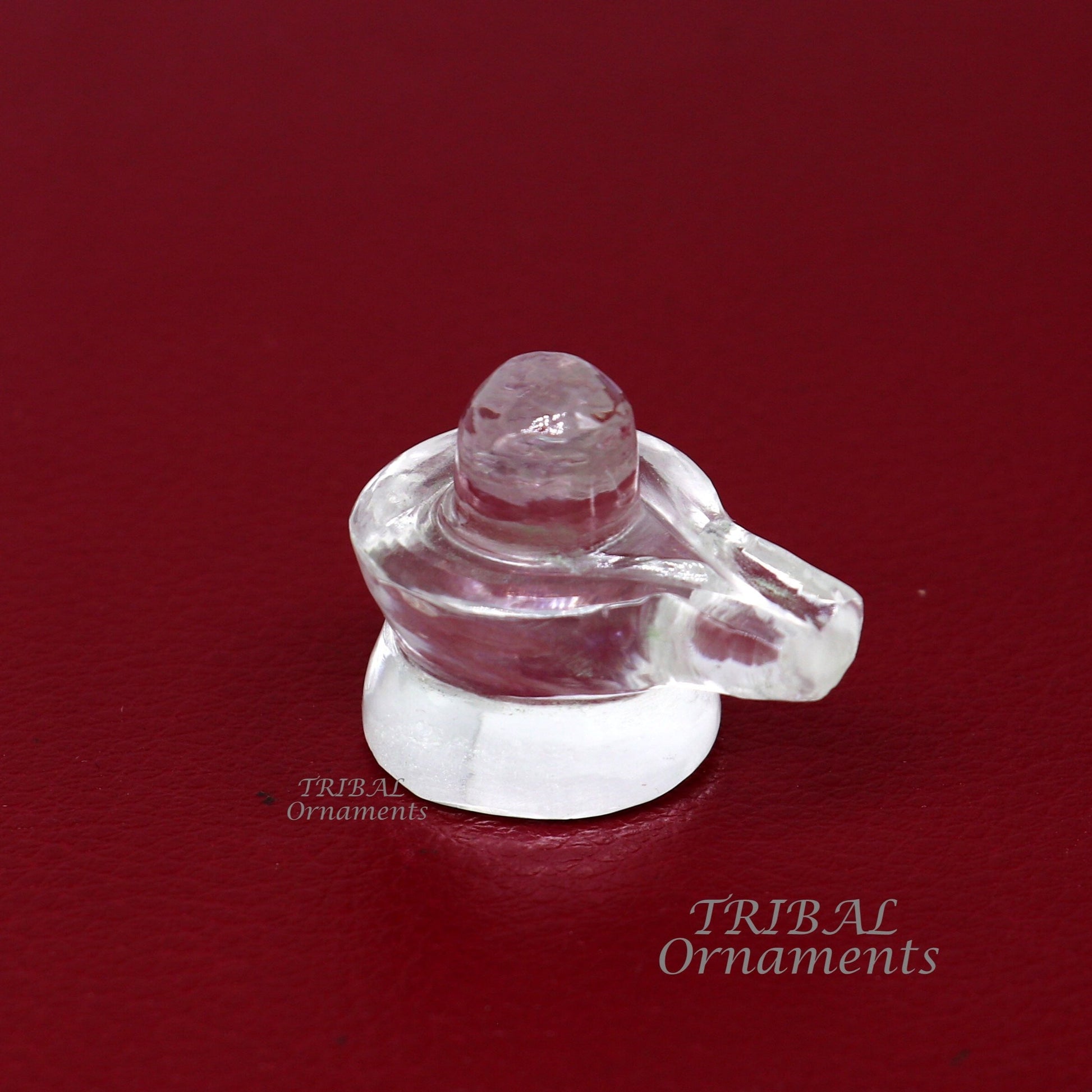 Natural Sphatik crystal Shiva Lingam statue by Tribal Ornaments, a divine stone for wealth and prosperity, used in puja rituals.