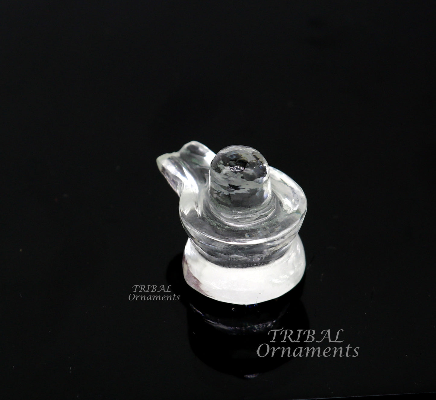 Natural sphatik crystal Shiva Lingam statue by Tribal Ornaments, used for wealth and prosperity in puja rituals.