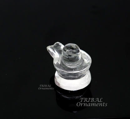 Natural sphatik crystal Shiva Lingam statue by Tribal Ornaments, used for wealth and prosperity in puja rituals.
