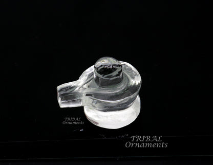 Natural sphatik crystal Shiva Lingam statue by TRIBAL ORNAMENTS, a divine stone for wealth and prosperity puja.