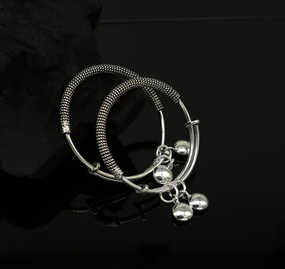 Sterling silver adjustable baby bangle with charms, oxidized finish, suitable for newborns and kids, from TRIBAL ORNAMENTS.