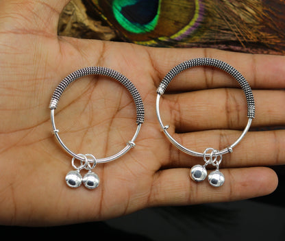Sterling silver adjustable baby charm bangle with intricate oxidized design, perfect for newborn kids jewelry by Tribal Ornaments.
