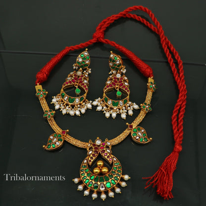 Gold polished sterling silver peacock charm necklace with pearls, floral design, crafted by TRIBAL ORNAMENTS.