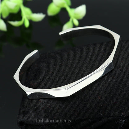 Shiny 925 sterling silver adjustable cuff bangle bracelet by Tribal Ornaments, unisex handmade jewelry for gifting or everyday wear.