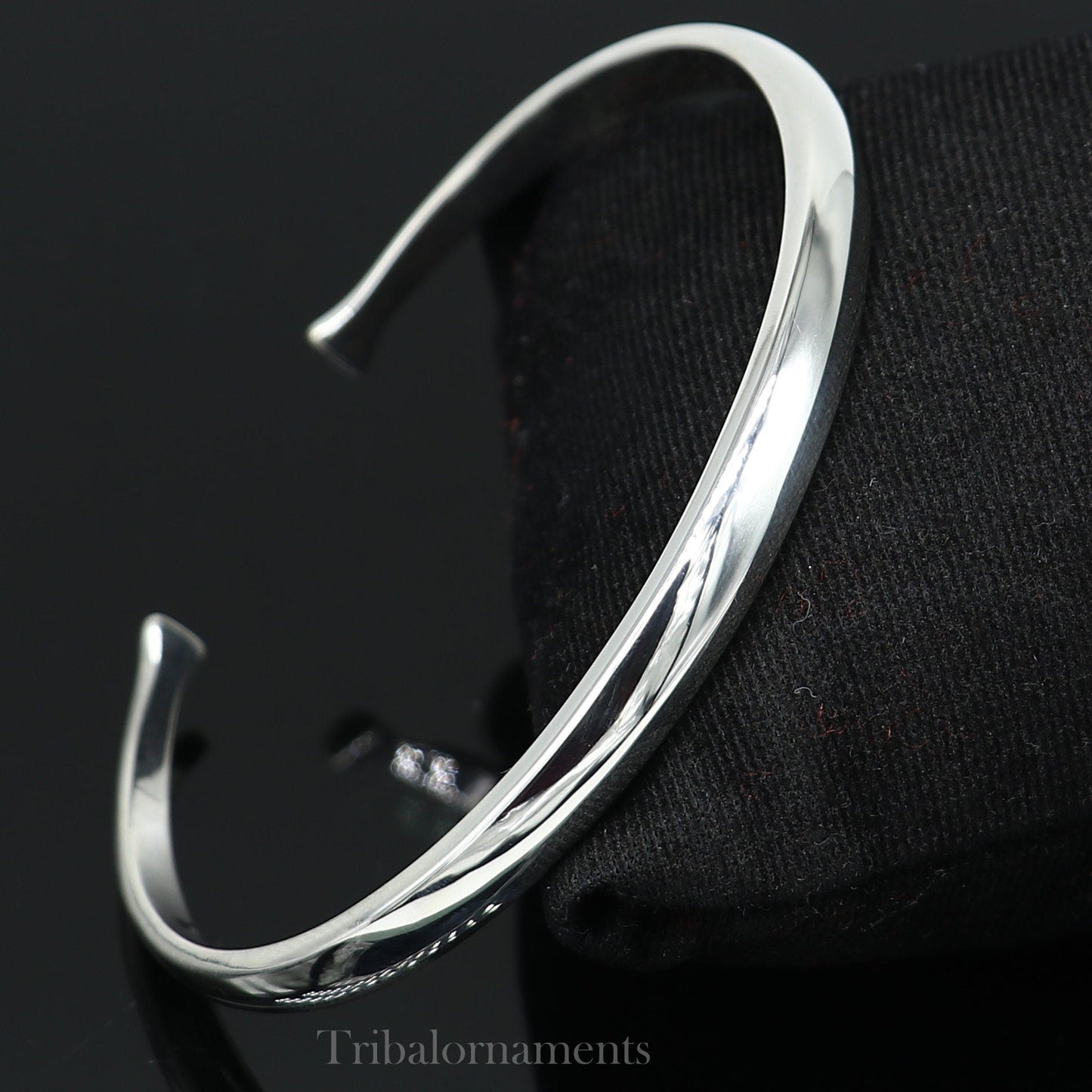 Shiny solid 925 sterling silver adjustable cuff bangle bracelet by Tribal Ornaments, unisex jewelry with a sleek, handmade design.
