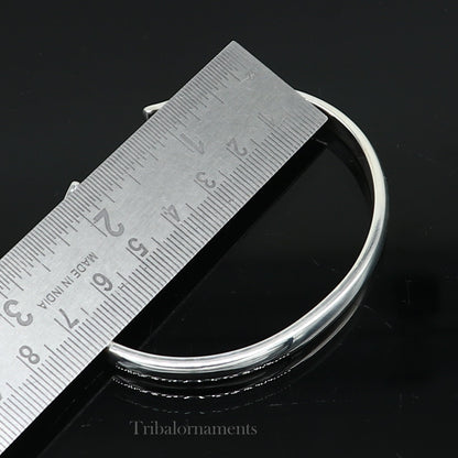 Shiny solid 925 sterling silver adjustable cuff bangle bracelet by Tribal Ornaments, unisex jewelry with a sleek, handmade design.