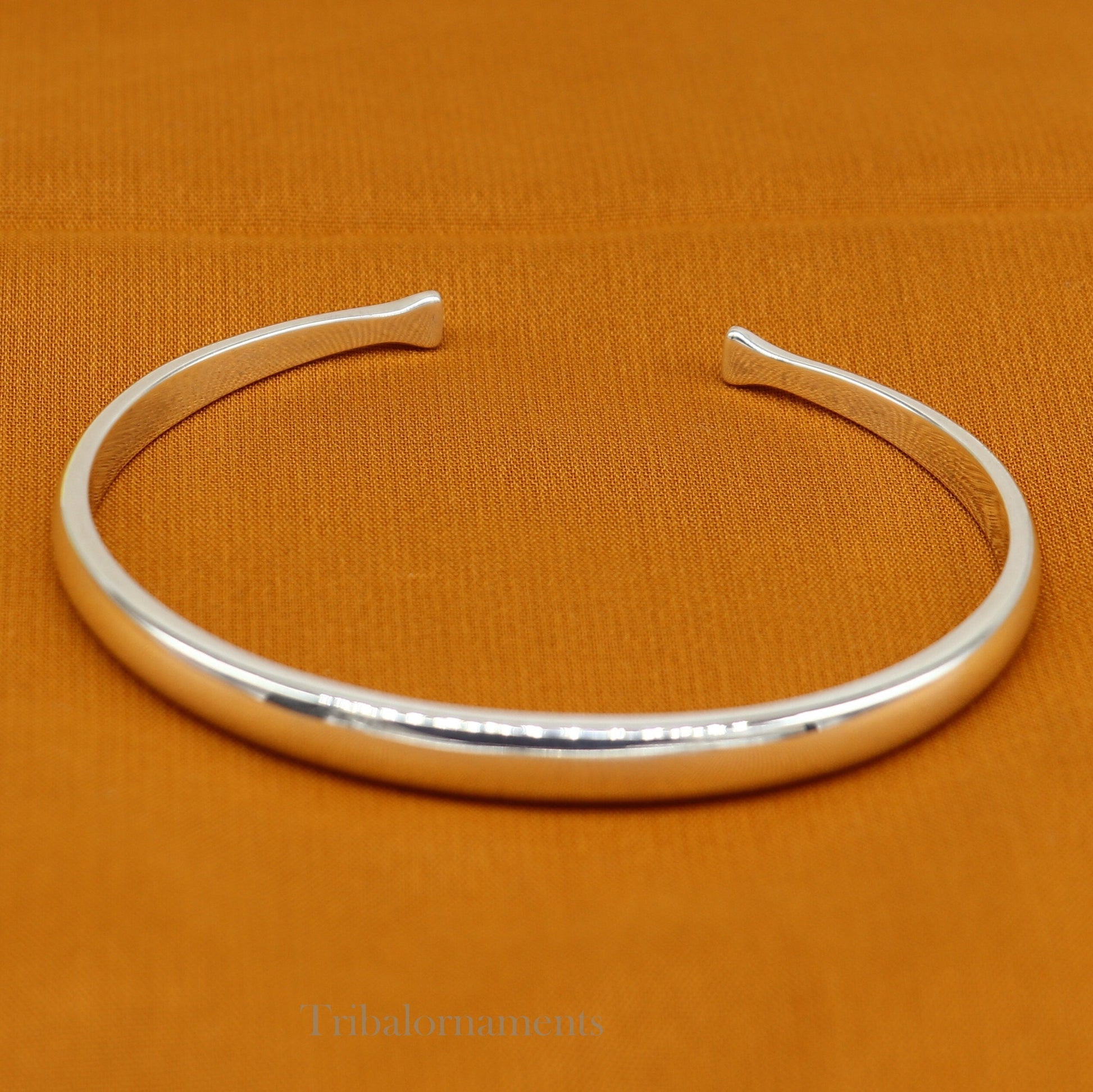 Shiny solid 925 sterling silver adjustable cuff bangle bracelet by Tribal Ornaments, unisex jewelry with a sleek, handcrafted design.