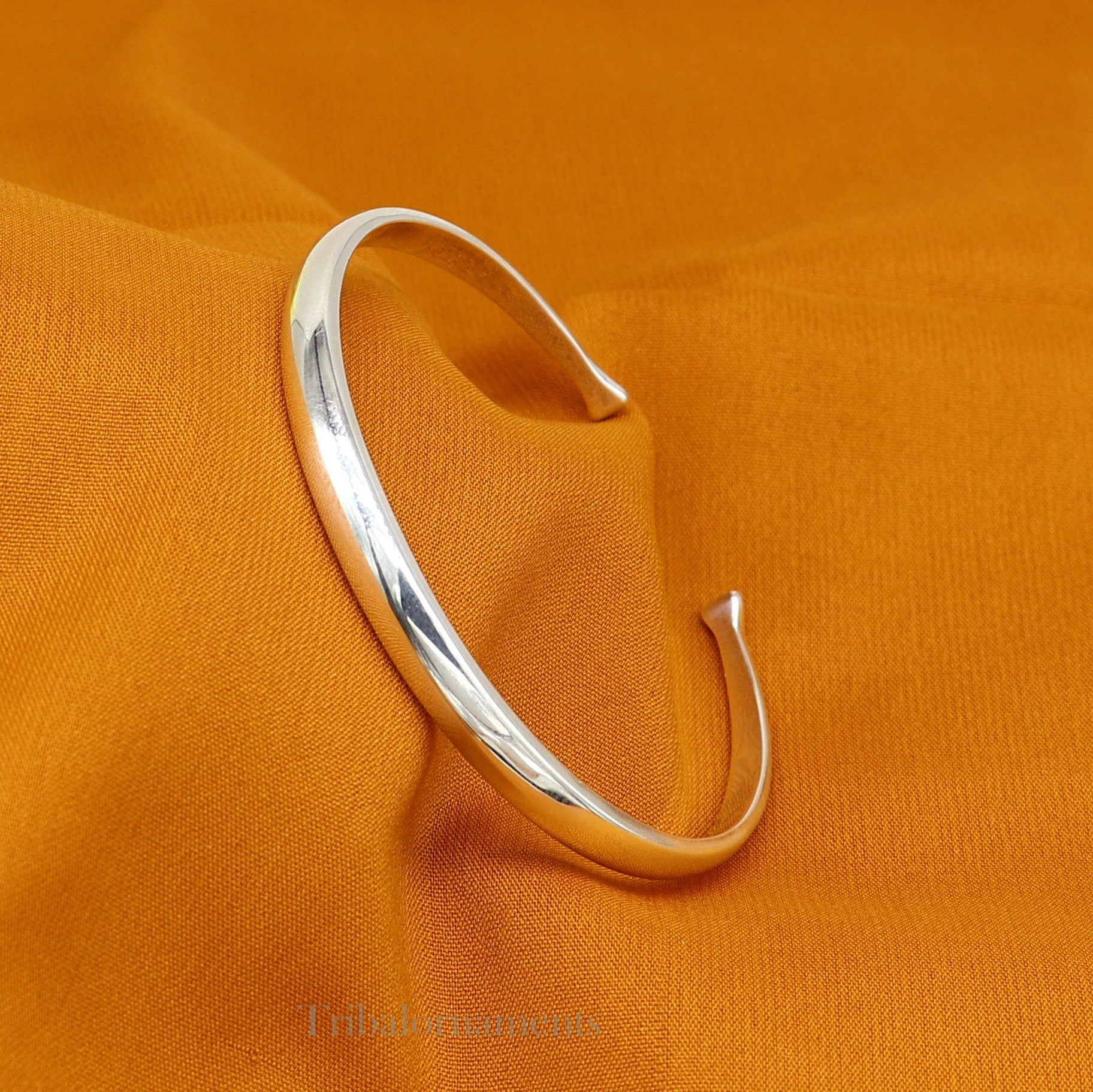 Shiny solid 925 sterling silver adjustable cuff bangle bracelet from Tribal Ornaments, unisex jewelry for gifting or everyday wear.