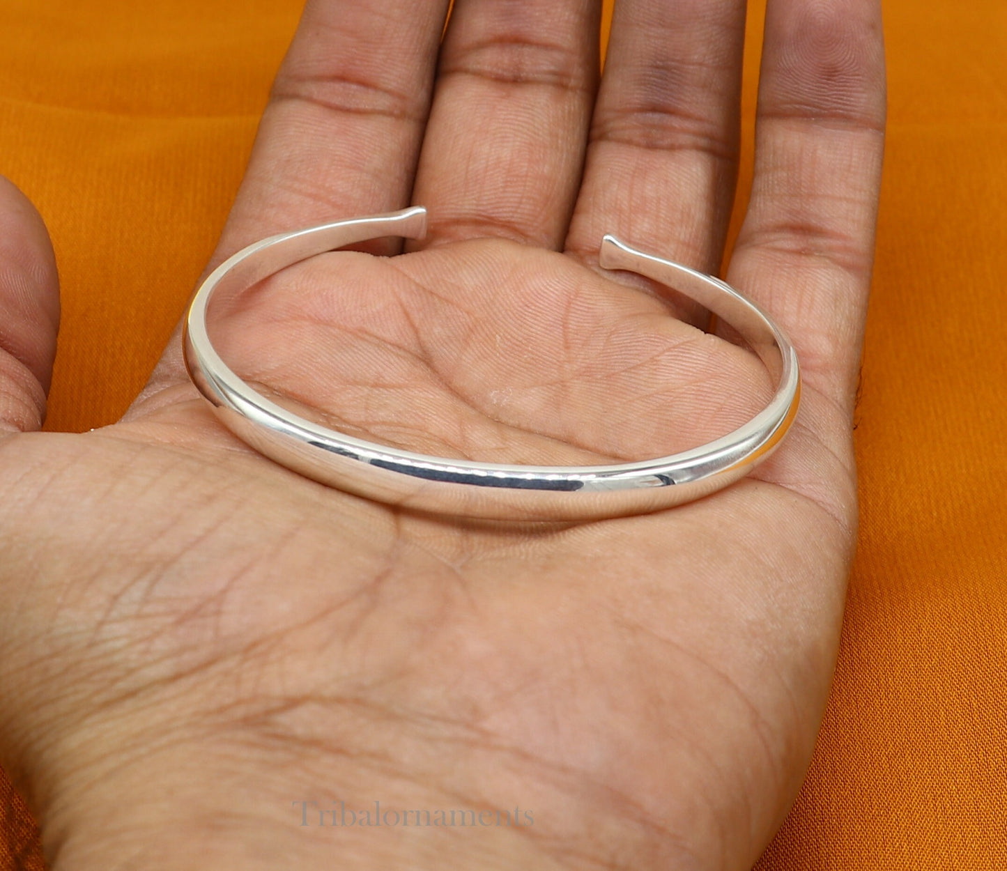 Shiny solid 925 sterling silver adjustable cuff bangle bracelet by TRIBAL ORNAMENTS, unisex jewelry with a sleek, handmade design.