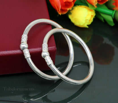 Shiny sterling silver stylish bangle bracelet by Tribal Ornaments, elegant designer kada jewelry for gifting or brides.
