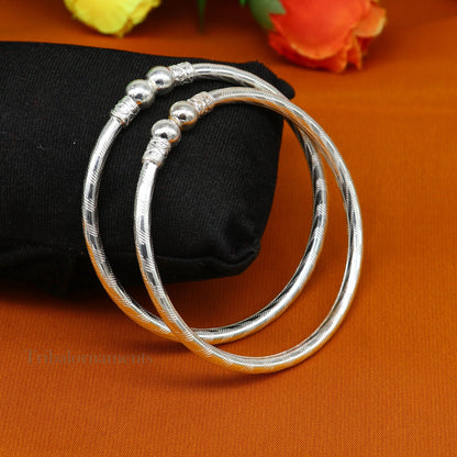 Sterling silver handmade bangle bracelet with plain white design, unisex tribal ornament jewelry, custom-designed kada for gifting.