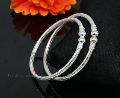 Sterling silver handmade bangle bracelet with plain white design, unisex jewelry from Tribal Ornaments featuring custom craftsmanship.