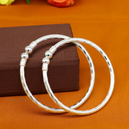 Sterling silver handmade bangle bracelet with plain white design, unisex, crafted by Tribal Ornaments.