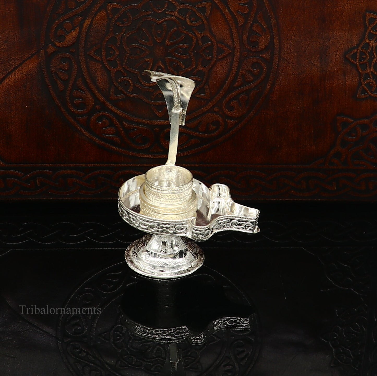 Pure 925 sterling silver Lord Shiva Lingam stand for home temple puja, featuring intricate Shiva Vratam art by Tribal Ornaments.