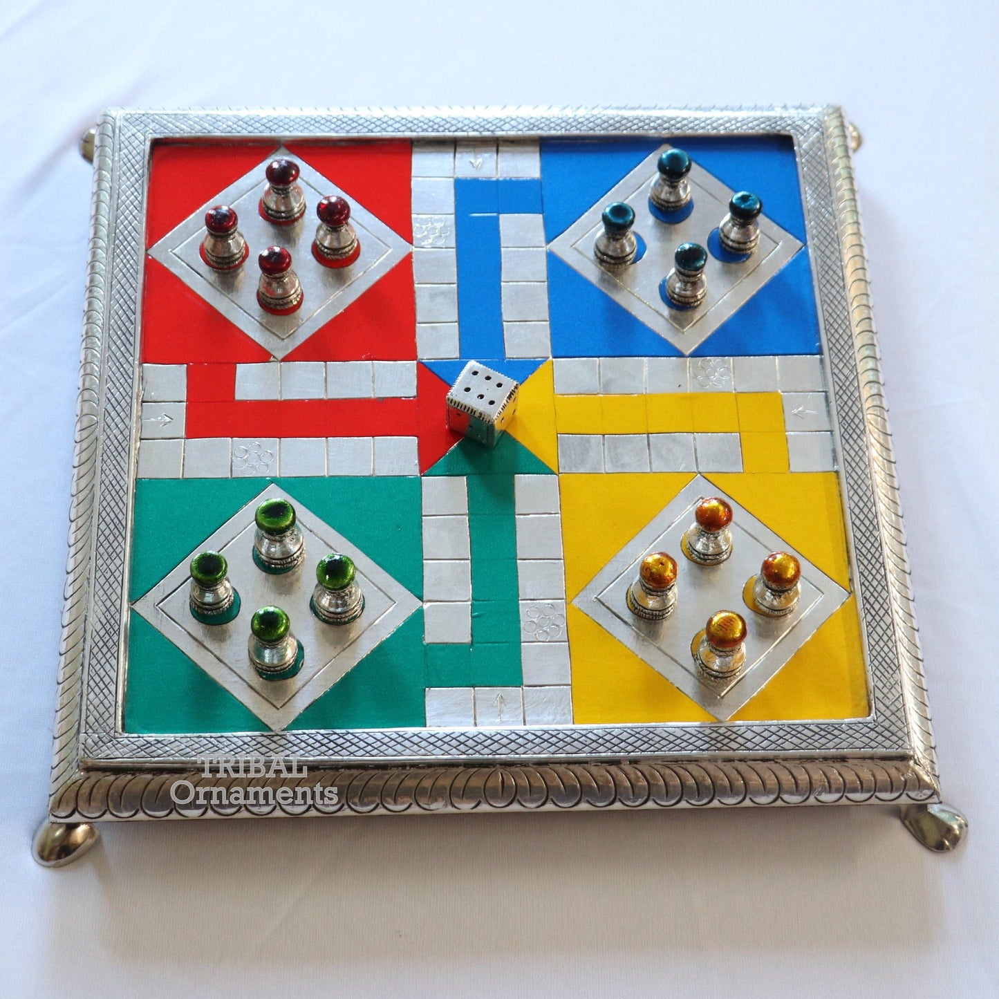 Sterling silver handcrafted LUDO game board on wooden base, featuring intricate tribal design by TRIBAL ORNAMENTS.
