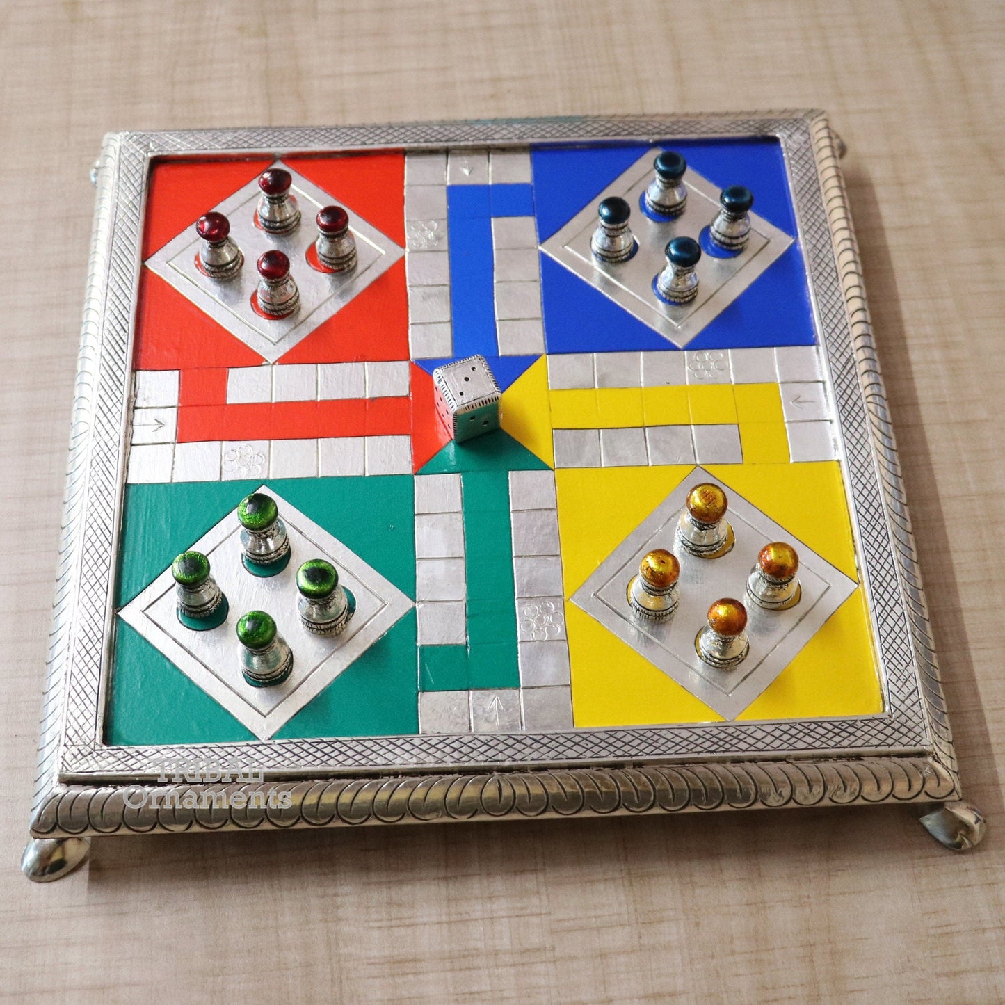 Sterling silver handcrafted LUDO game board with intricate design on wooden base by TRIBAL ORNAMENTS.