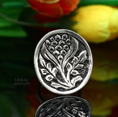 Sterling silver handmade flower-shaped adjustable ring by Tribal Ornaments, unisex tribal ethnic jewelry with chitai work design.