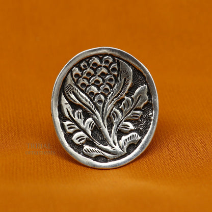 Sterling silver handmade flower-shaped adjustable ring by TRIBAL ORNAMENTS, unisex tribal ethnic jewelry with chitai work design.