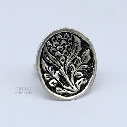 Sterling silver handmade flower-shaped adjustable unisex ring by TRIBAL ORNAMENTS with tribal chitai design and ethnic jewelry style.