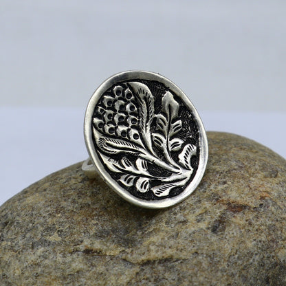 Sterling silver handmade flower-shaped adjustable ring by TRIBAL ORNAMENTS, featuring tribal ethnic design and unisex style.