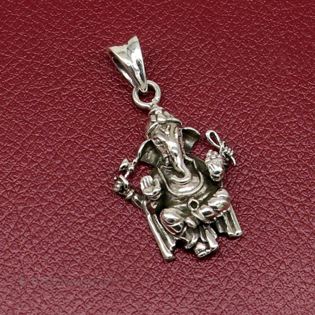 Sterling silver Ganesha pendant by Tribal Ornaments, handmade unisex jewelry with intricate design and customizable features.