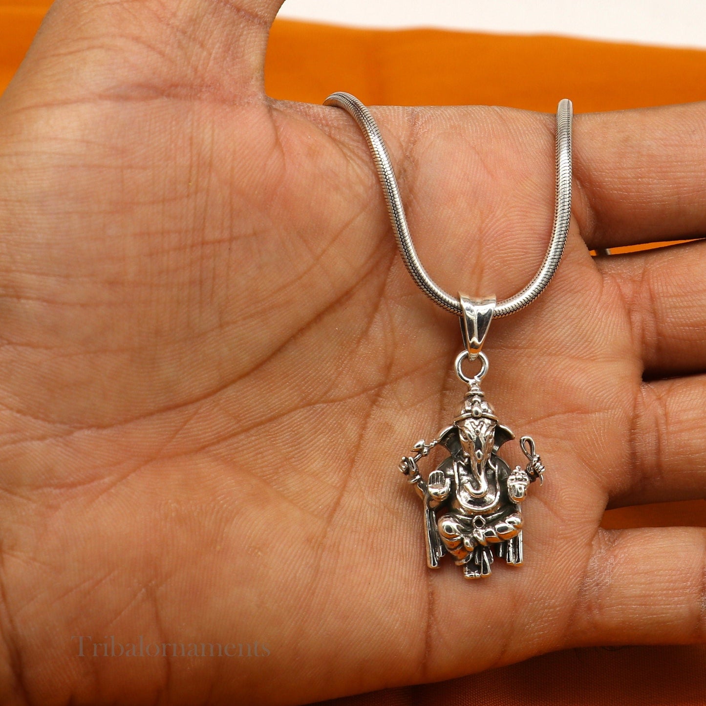 Sterling silver Ganesha pendant by TRIBAL ORNAMENTS, handmade unisex jewelry featuring a detailed God Ganesha idol.