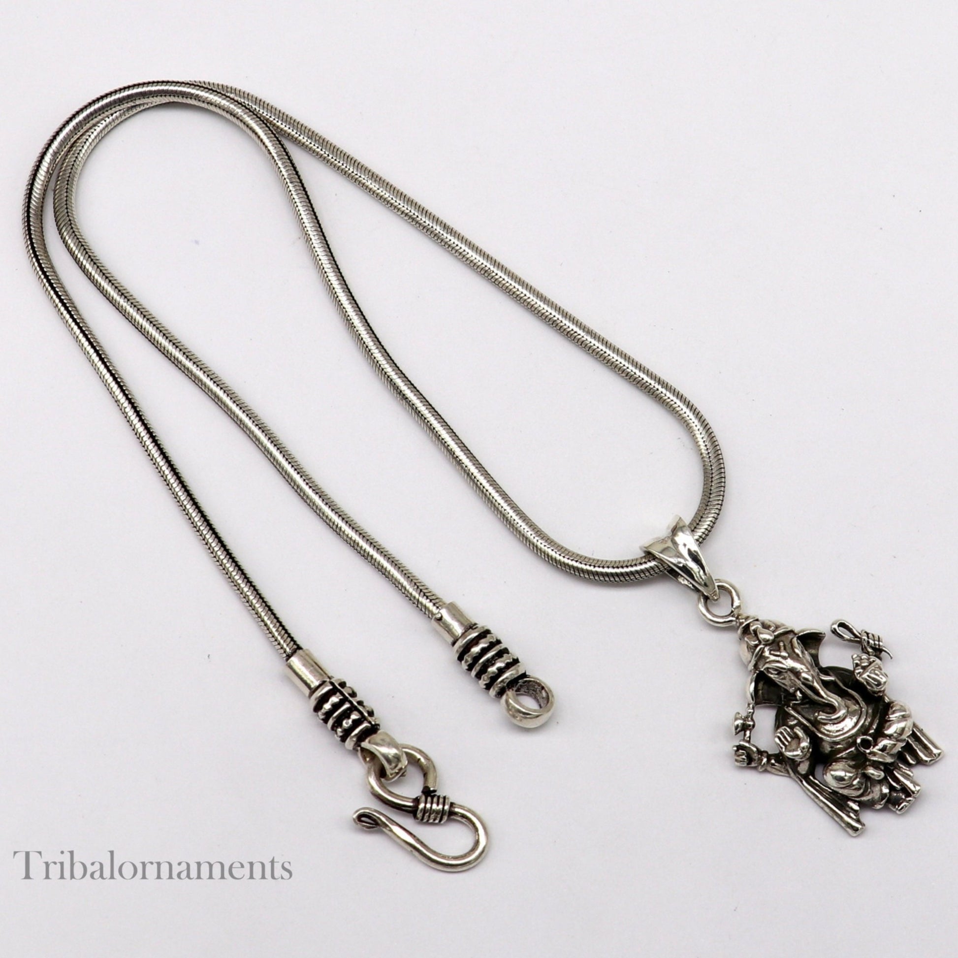 Handmade 925 sterling silver Ganesha pendant by TRIBAL ORNAMENTS, stylish unisex jewelry with intricate design and customized details.