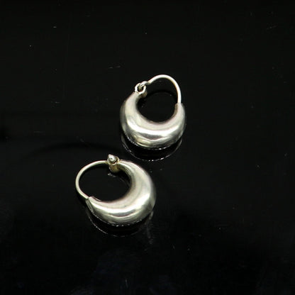 Handmade sterling silver hoop earrings with tribal vintage design, featuring hook ear wires for daily wear and elegant style.