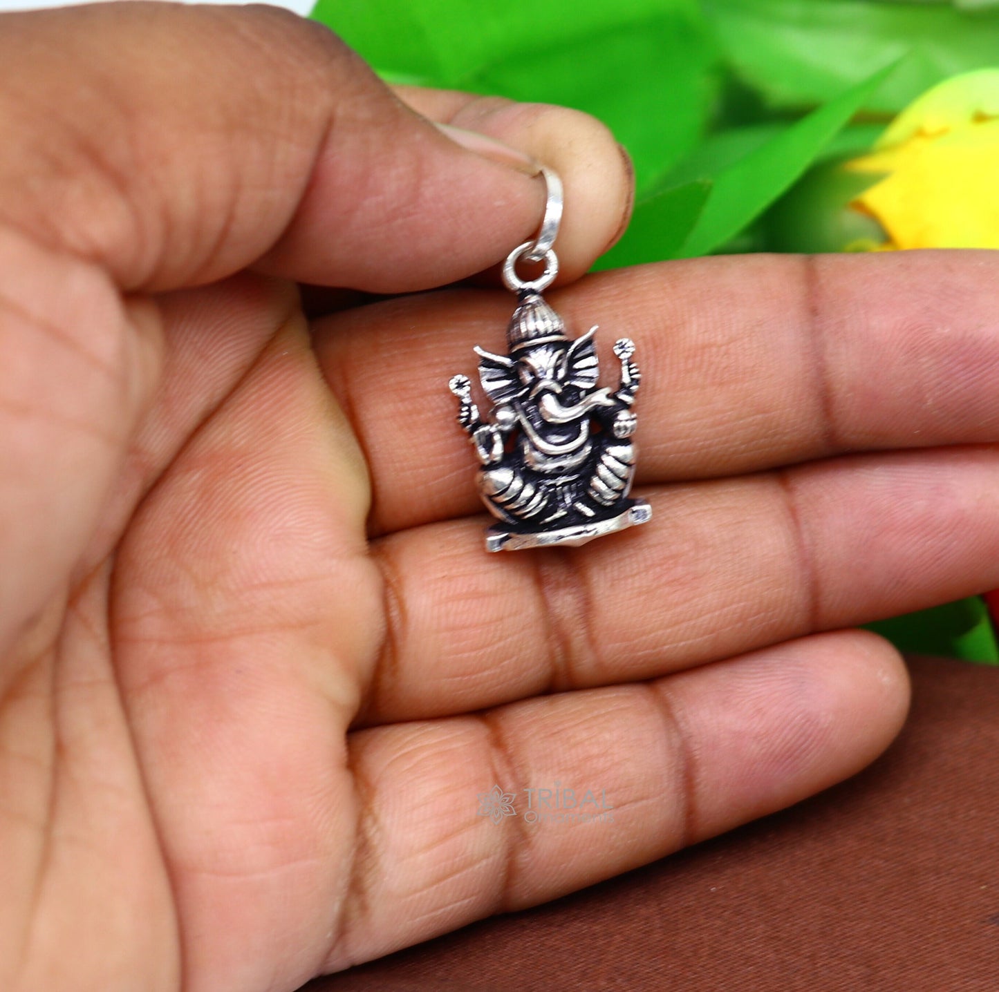 Sterling silver Lord Ganesha pendant by TRIBAL ORNAMENTS, unisex handmade jewelry with intricate tribal design and personalized style.